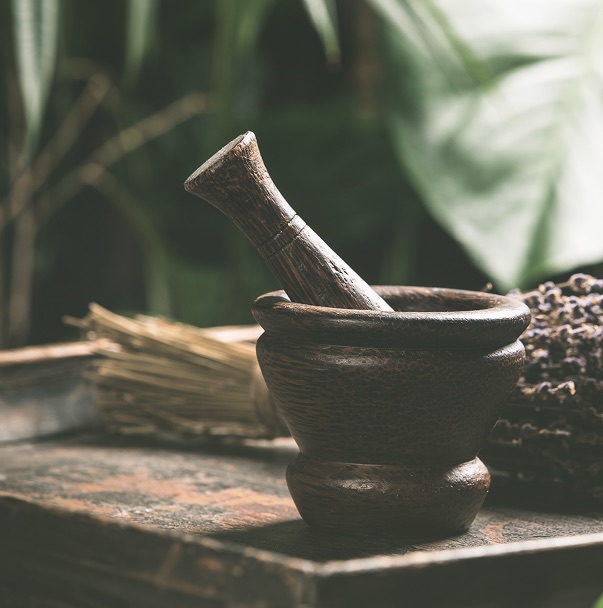Mortar and pestle with herbs